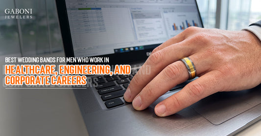 Gaboni Jewelers blog banner titled Best Wedding Bands for Men Who Work in Healthcare, Engineering, and Corporate Careers with a gold-tone band on an office laptop.   
